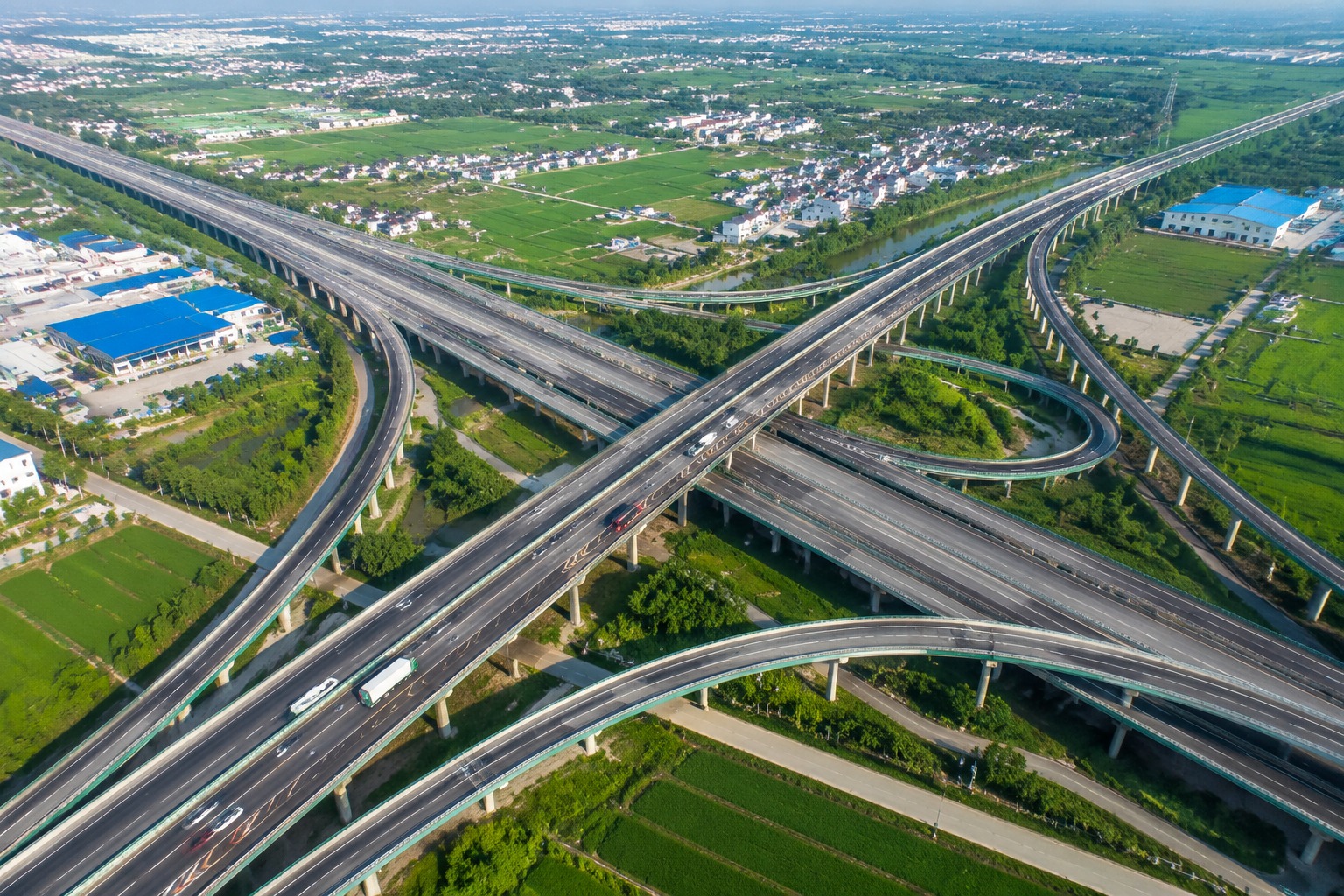 Aerial view of a busy expressway interchange connecting county towns and ports in China