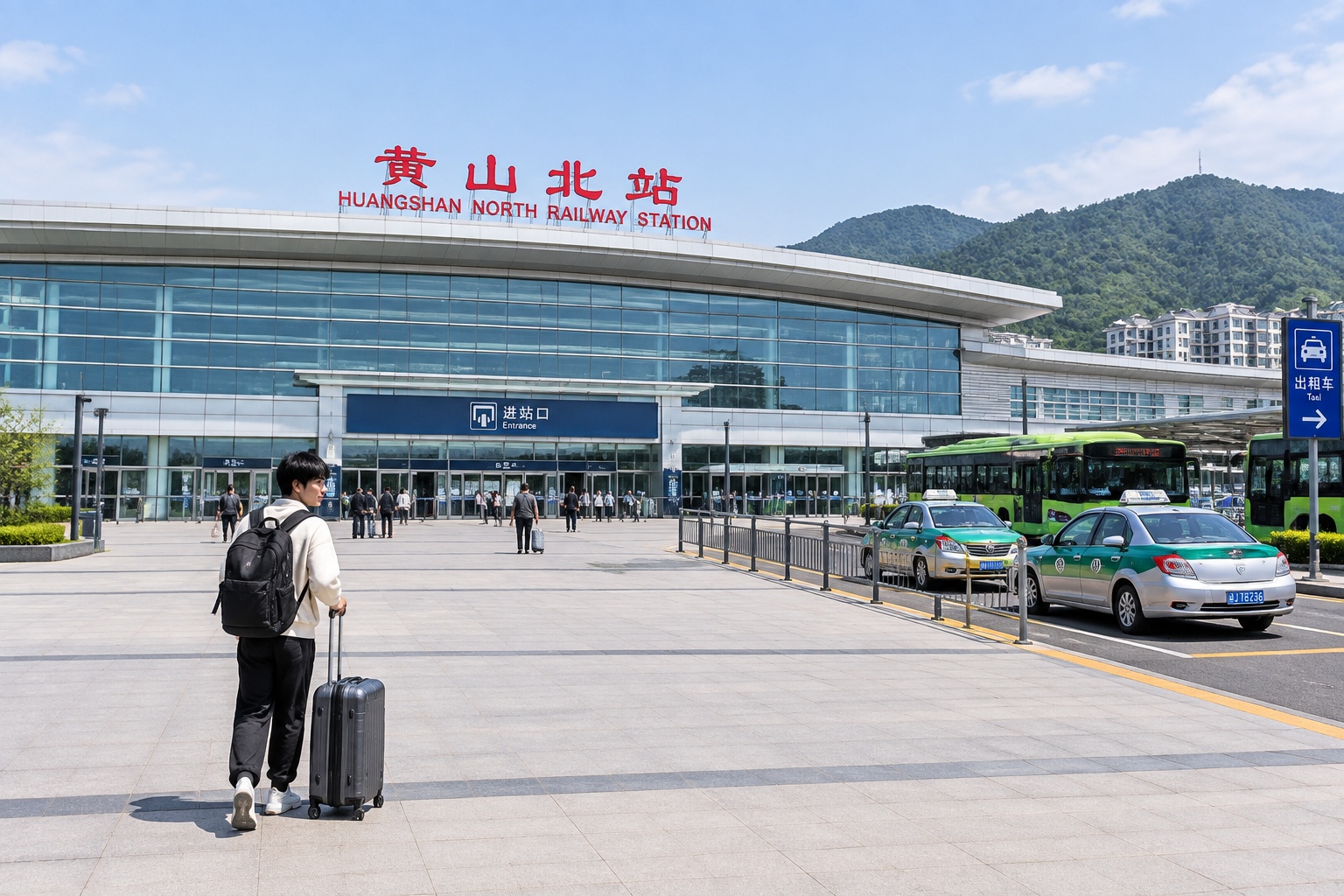 Shanghai to Huangshan in 2 Hours 18 Minutes: What a First-Timer Notices on China's High-Speed Rail 23 Huangshan North Railway Station in Anhui, with taxis and buses waiting on the plaza and a backpacker walking toward the entrance